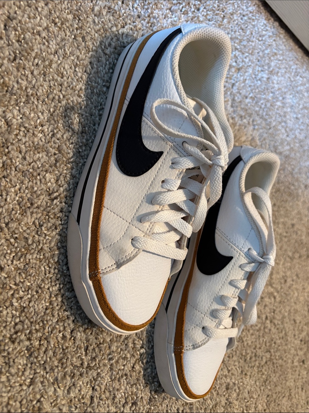 Nike White Leather Low-Top Sneakers with Black Swoosh and Brown Accent